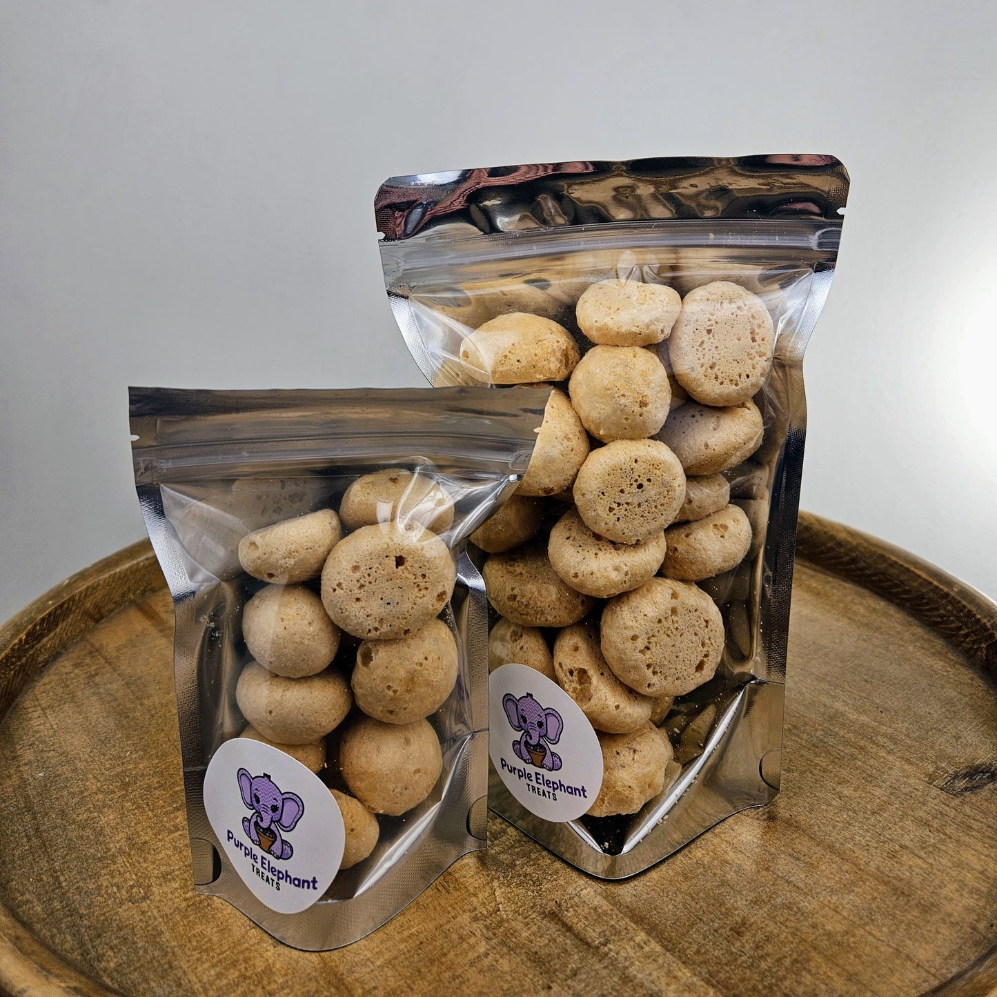 a small and large bag of honey bites on a table.